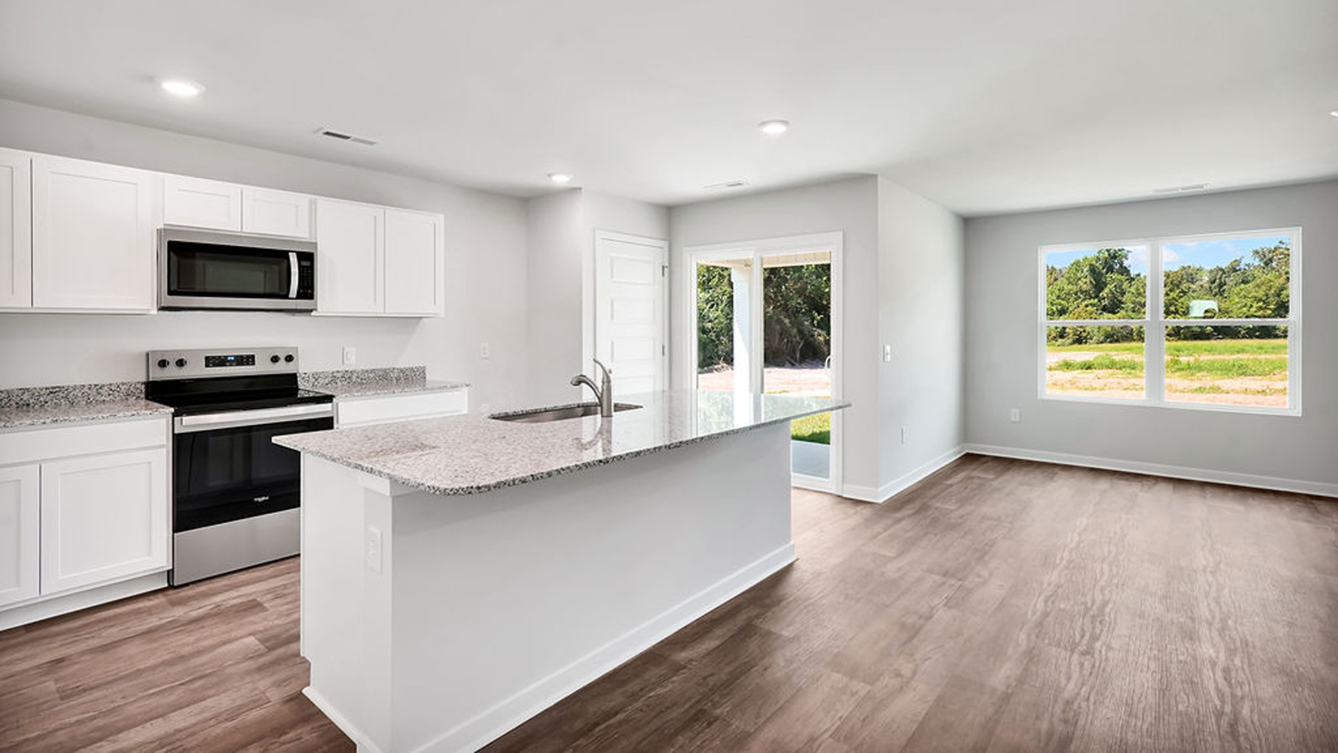 kitchen, and dining area feature stainless steel appliances