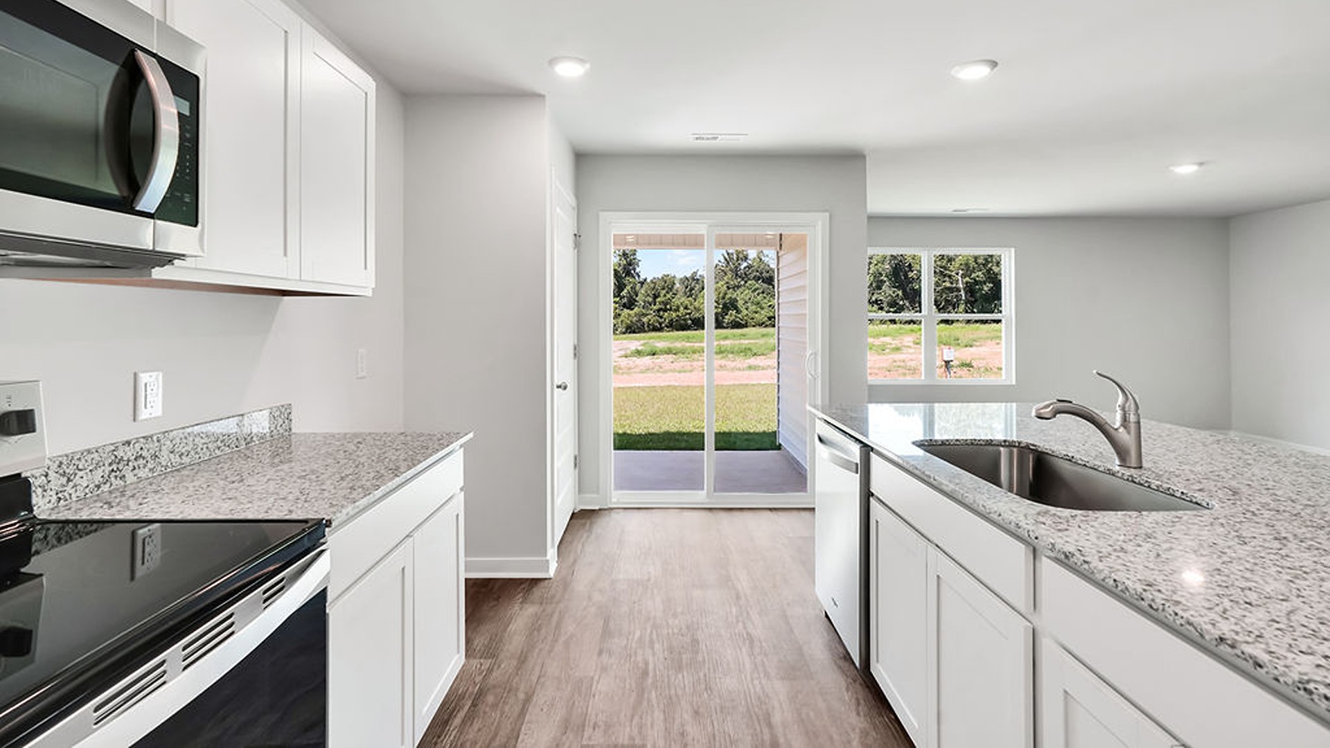 kitchen, and dining area feature stainless steel appliances