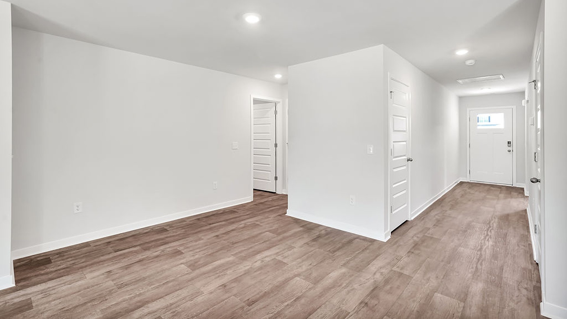 offers a open-concept family room, kitchen, and dining area