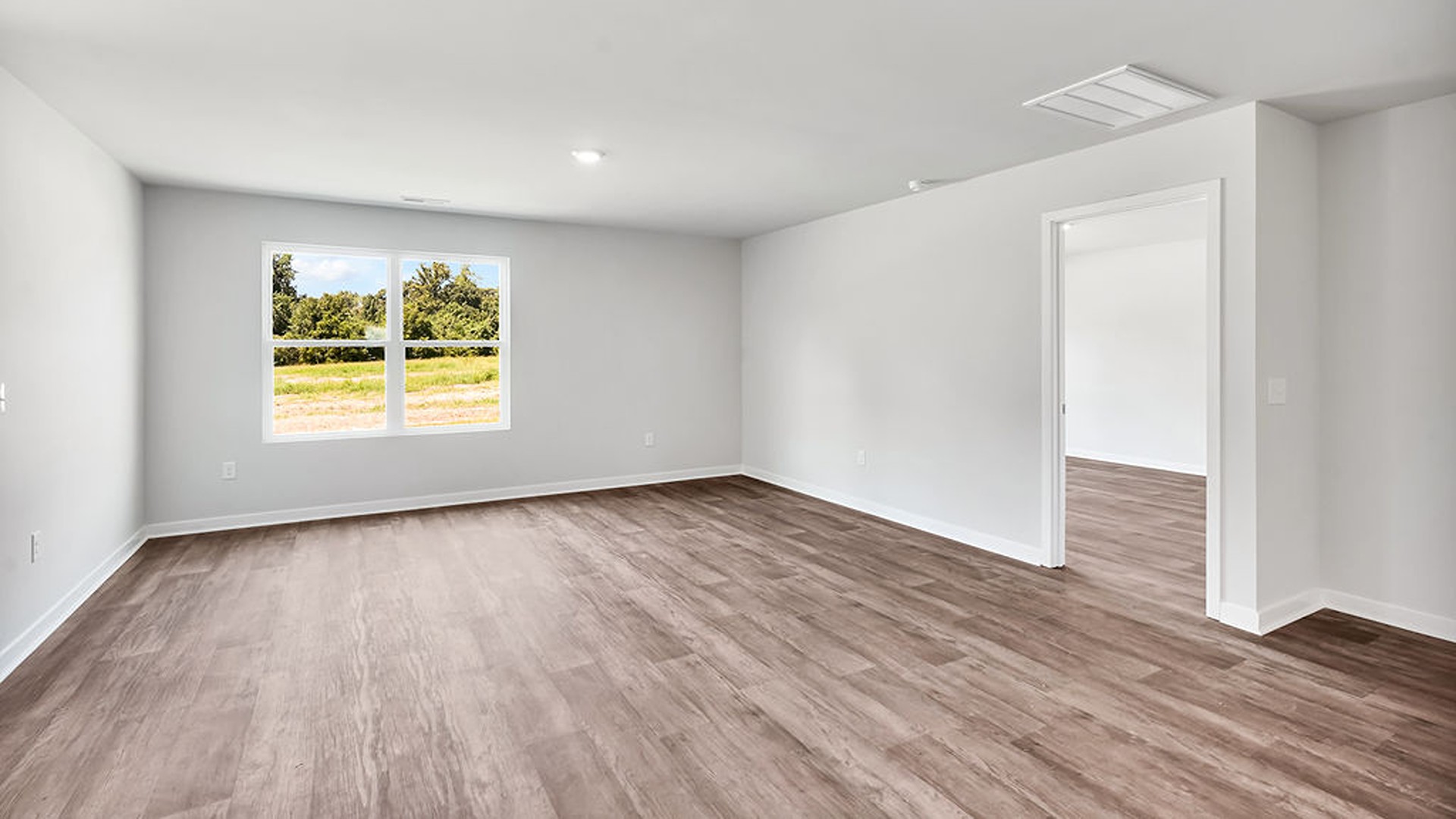 offers a open-concept family room, kitchen, and dining area