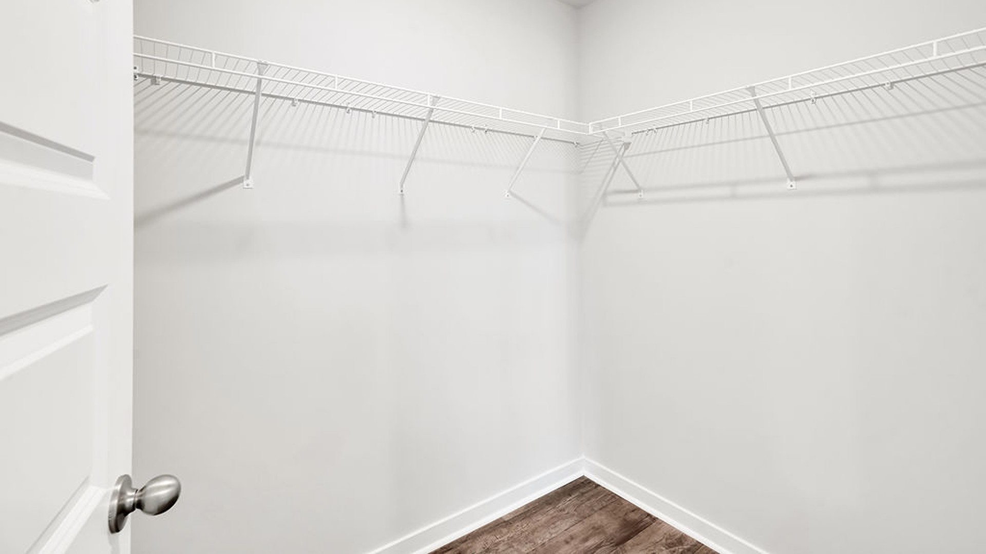the Primary Suite provides privacy with a large walk-in closet and walk-in shower.