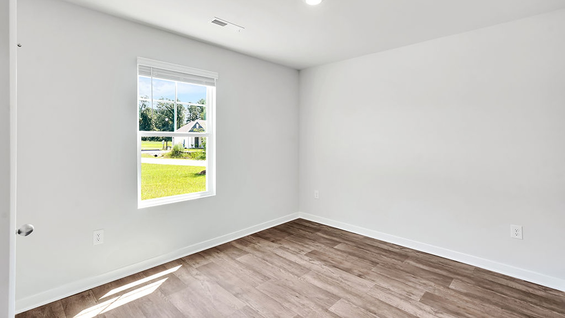 the Primary Suite provides privacy with a large walk-in closet and walk-in shower.