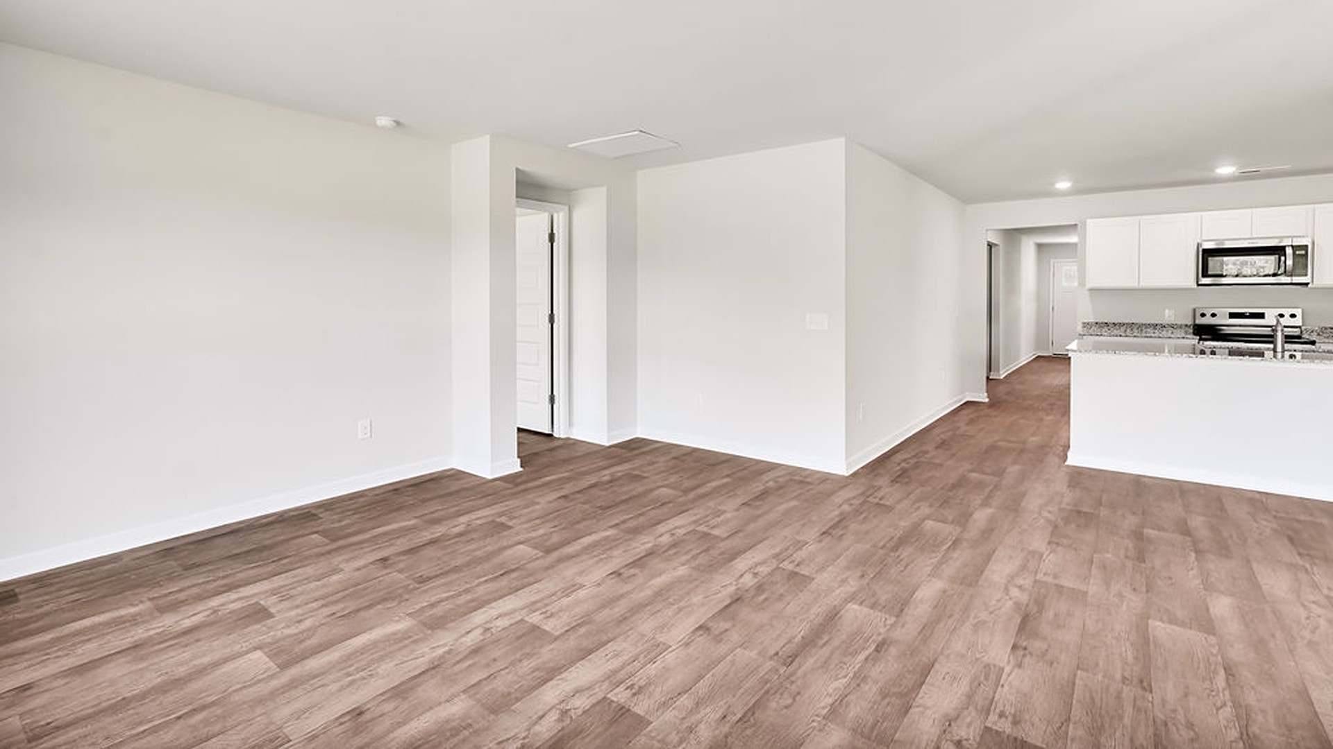 The living area is an open concept, where your kitchen, living, and dining areas blend seamlessly into a space perfect for everyday living and entertaining.