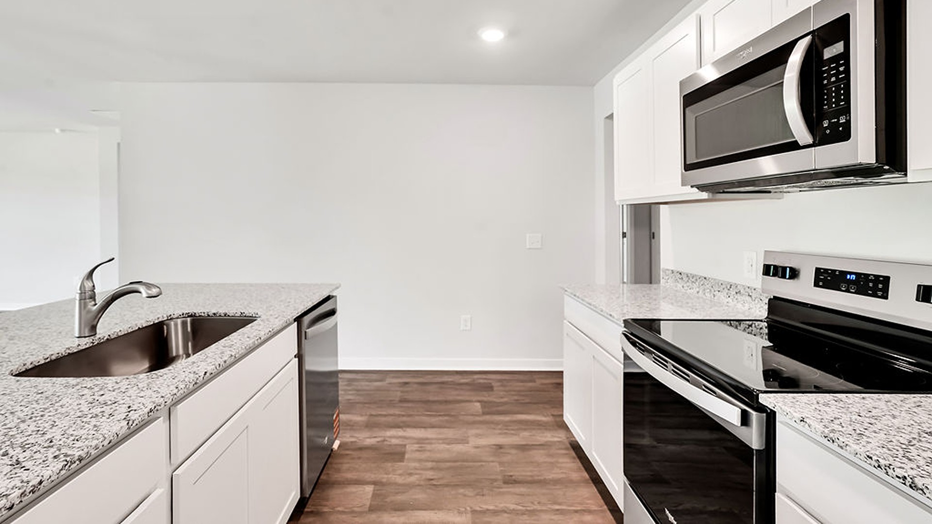 The kitchen features beautiful cabinets, granite countertops, and stainless-steel appliances, which are sure to both turn heads and make meal prep easy. You’ll never be too far from the action with the living and dining area right there.