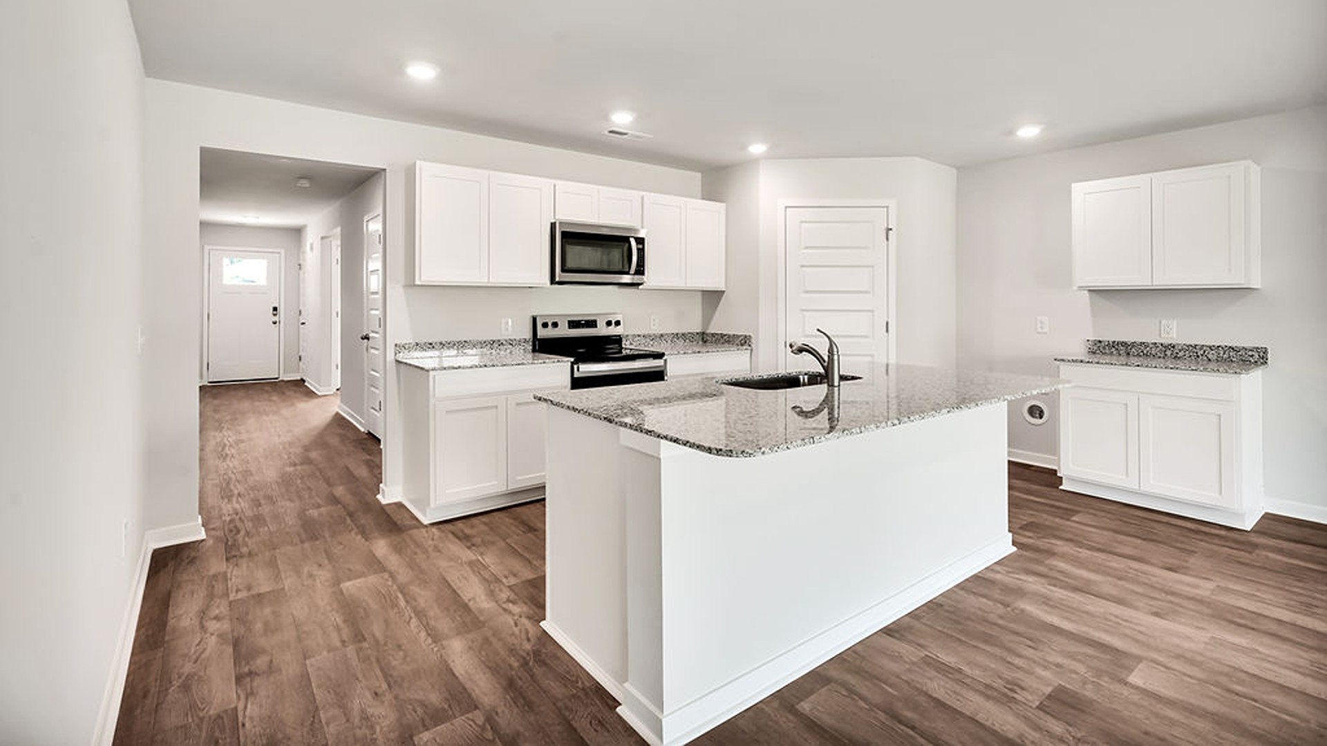 The kitchen features beautiful cabinets, granite countertops, and stainless-steel appliances, which are sure to both turn heads and make meal prep easy. You’ll never be too far from the action with the living and dining area right there.