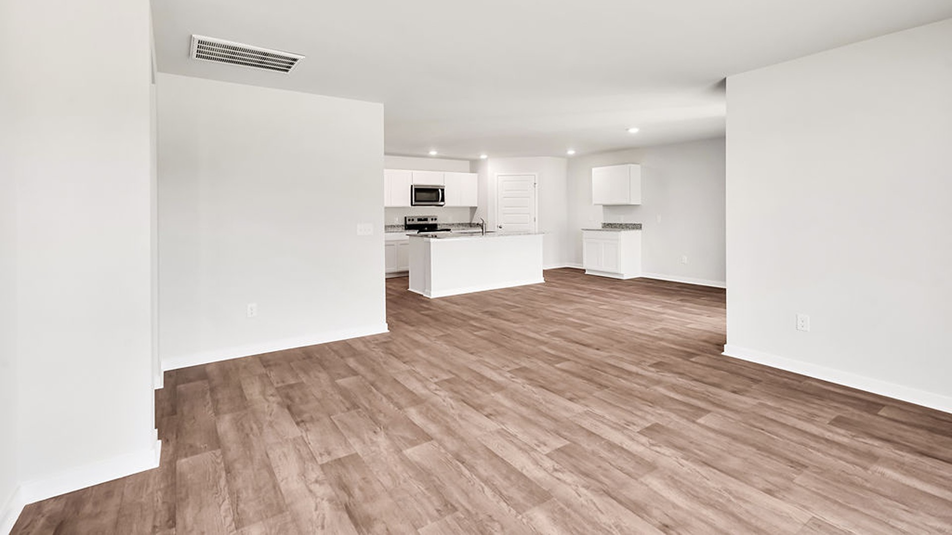 The living area is an open concept, where your kitchen, living, and dining areas blend seamlessly into a space perfect for everyday living and entertaining.