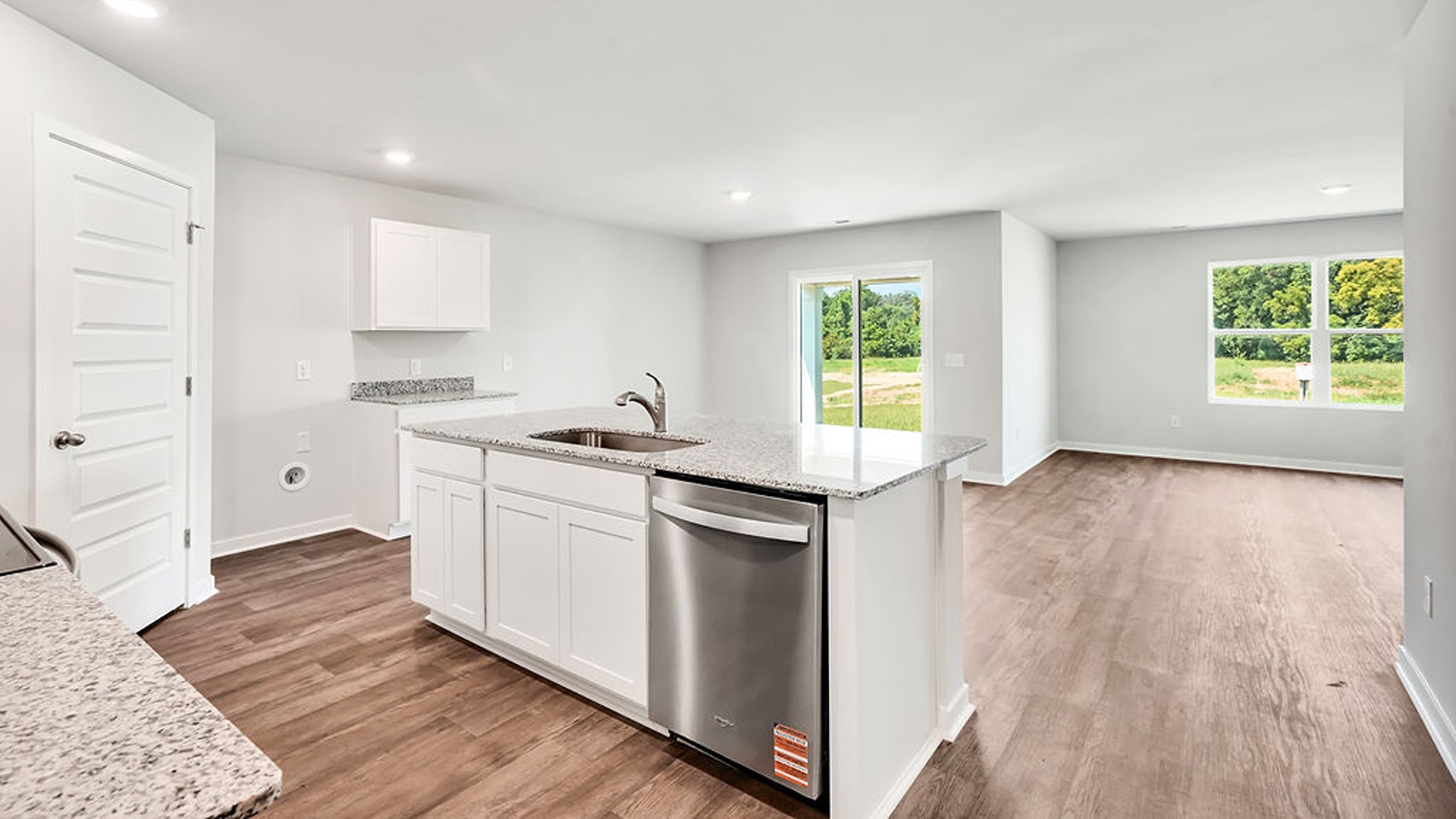 The kitchen features beautiful cabinets, granite countertops, and stainless-steel appliances