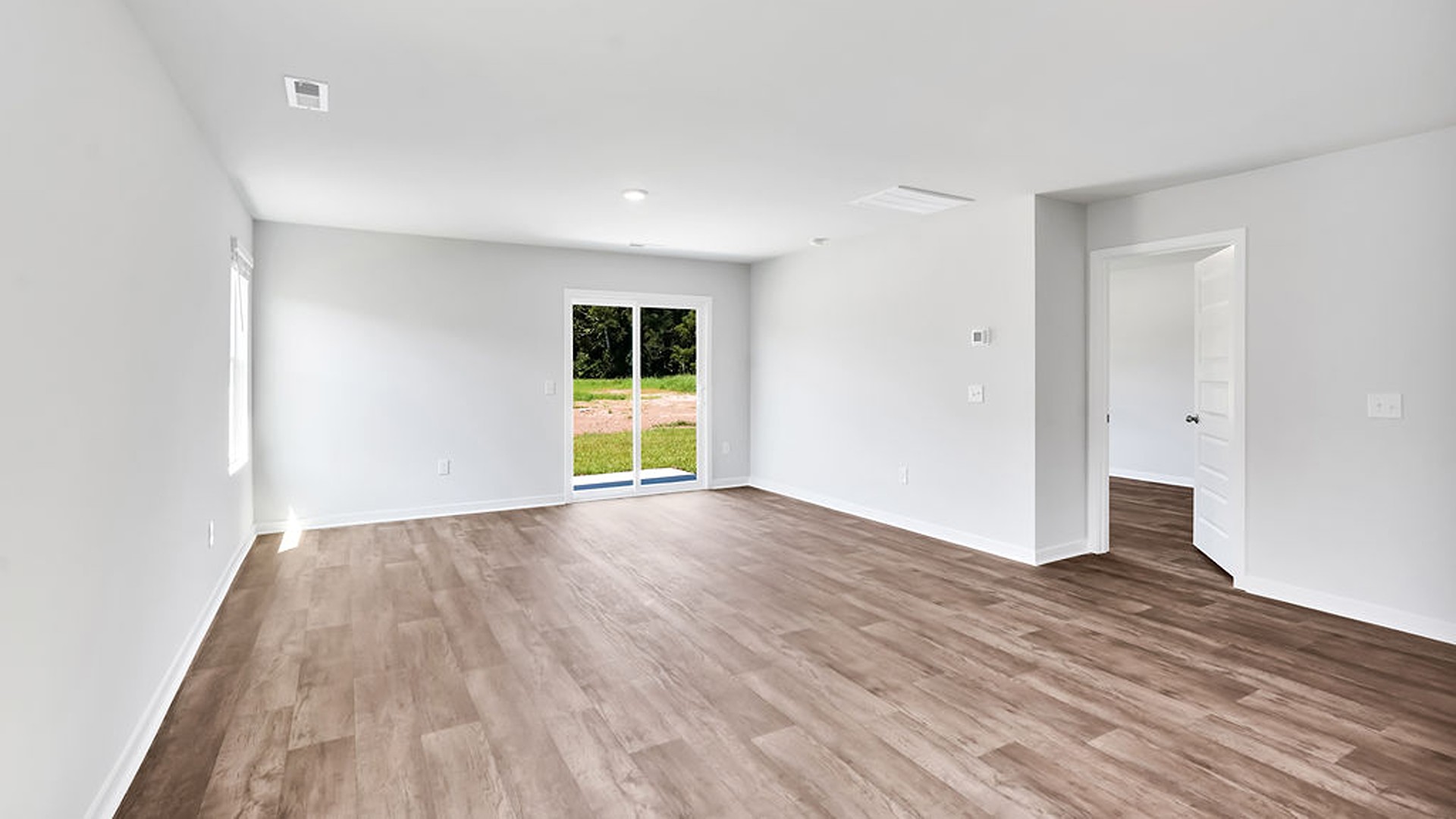 Entering the great room, we find the dining area, family room and a wonderful cook's kitchen are all together for open living