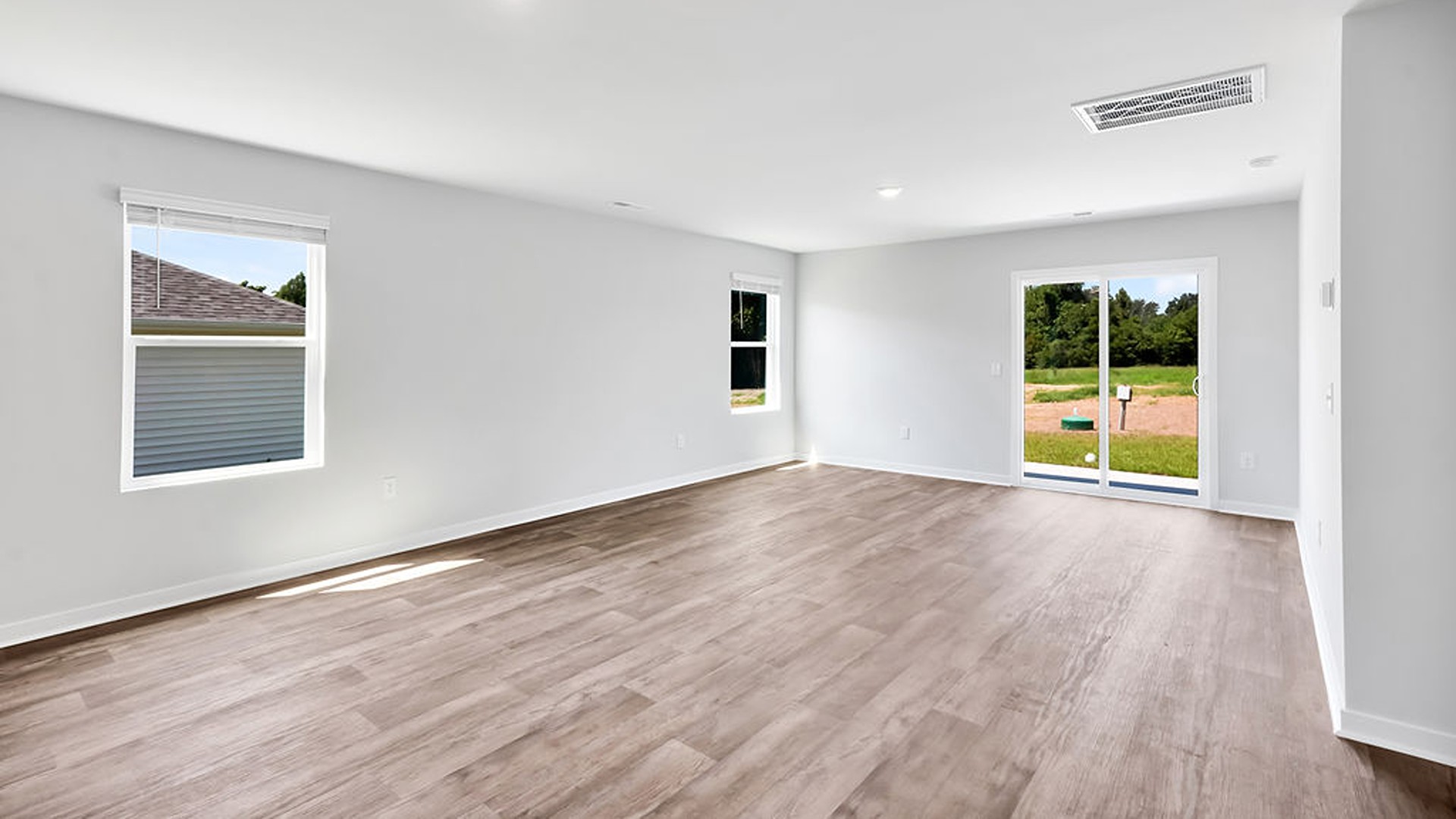 Entering the great room, we find the dining area, family room and a wonderful cook's kitchen are all together for open living