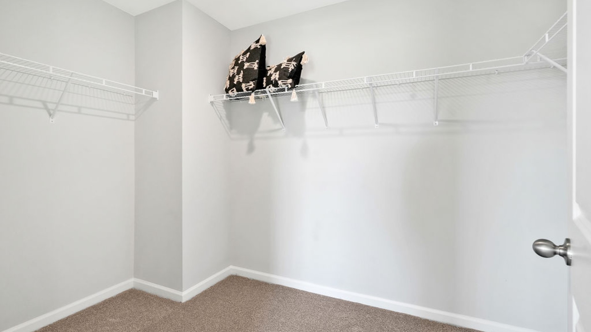 primary bedroom has its own attached bathroom that features a walk-in closet