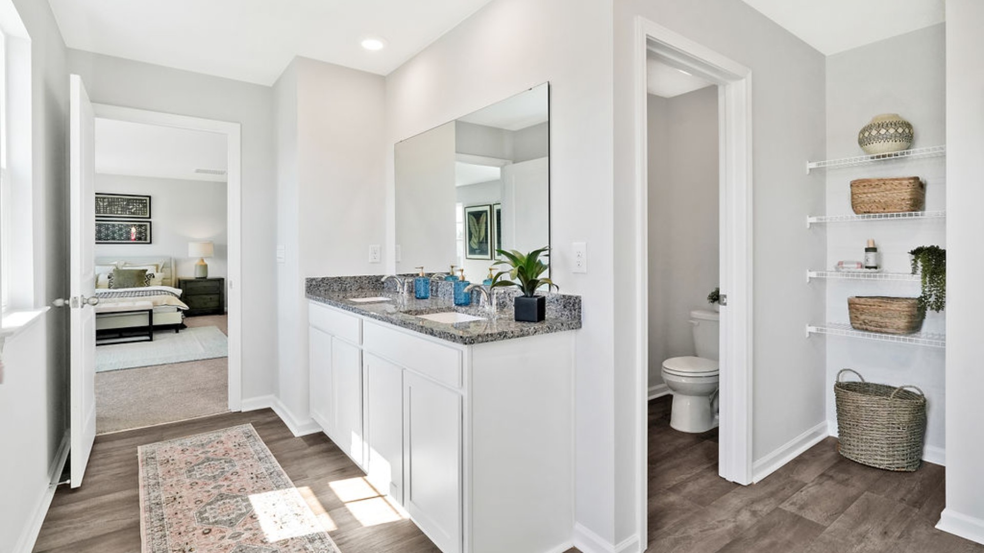 primary bedroom has its own attached bathroom that features a walk-in closet