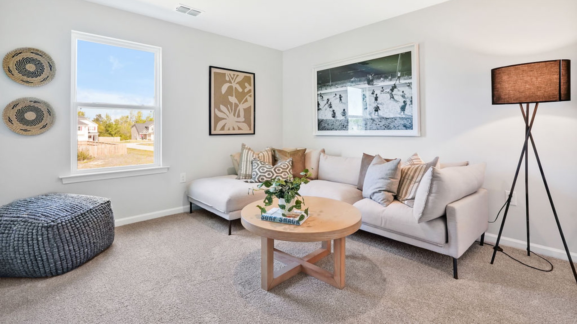 second floor includes three additional bedrooms and a convenient laundry room.