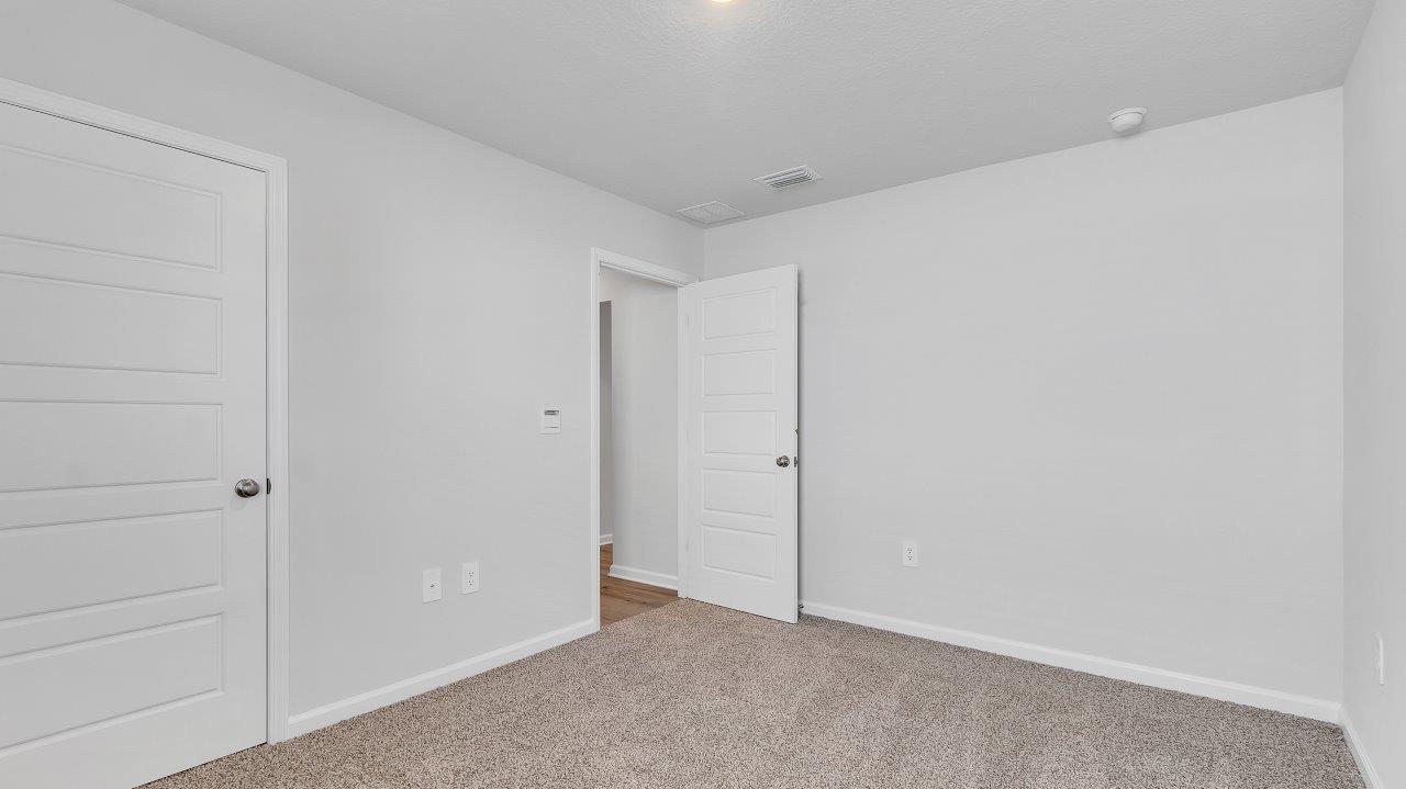 The primary bedroom offers ample space and is accompanied by an adjoining ensuite that showcases a double vanity with granite countertop, a generous standing shower, relaxing garden tub and a walk-in closet