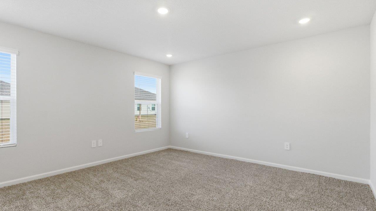 The primary bedroom offers ample space and is accompanied by an adjoining ensuite that showcases a double vanity with granite countertop, a generous standing shower, relaxing garden tub and a walk-in closet
