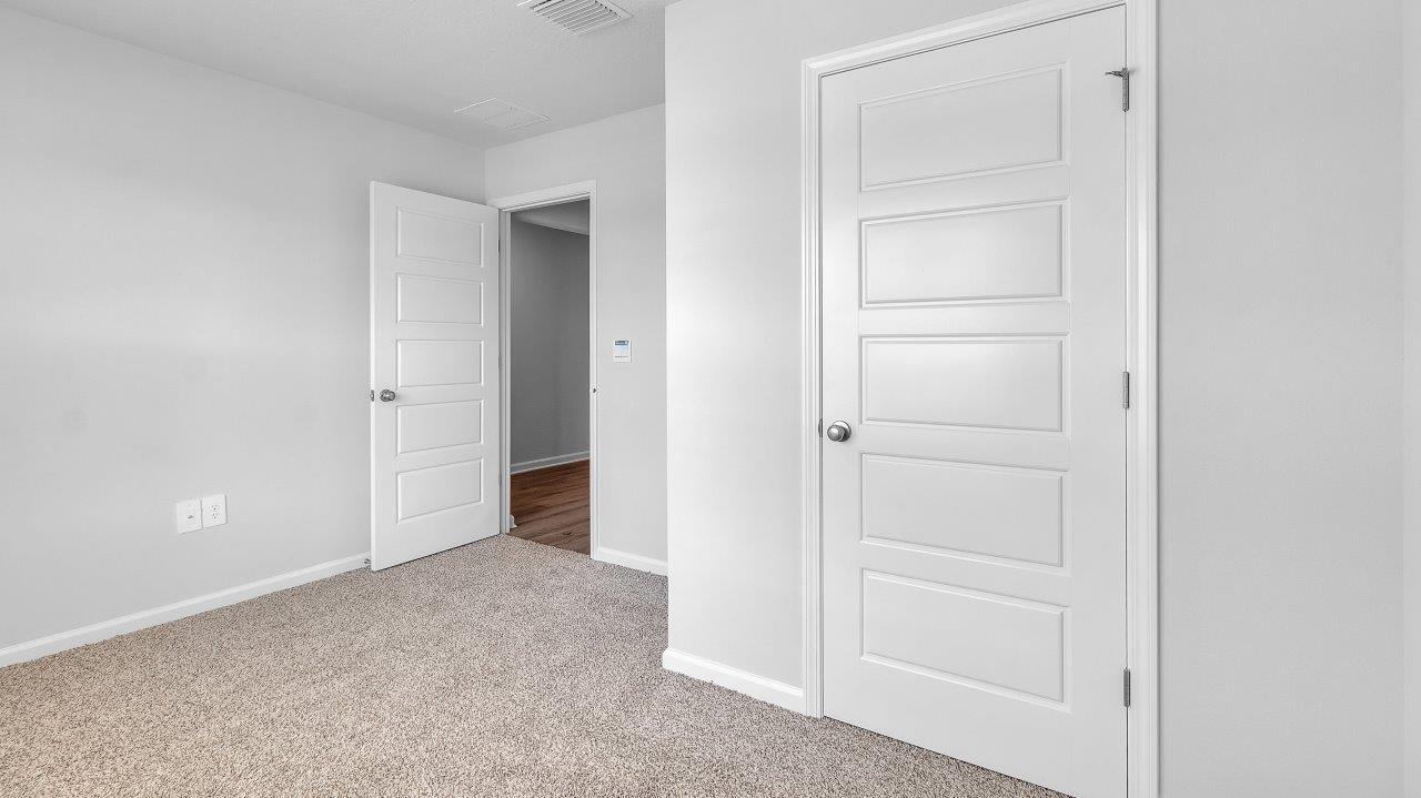 Entering the home, you’ll find access to two bedrooms that share a full bathroom.
