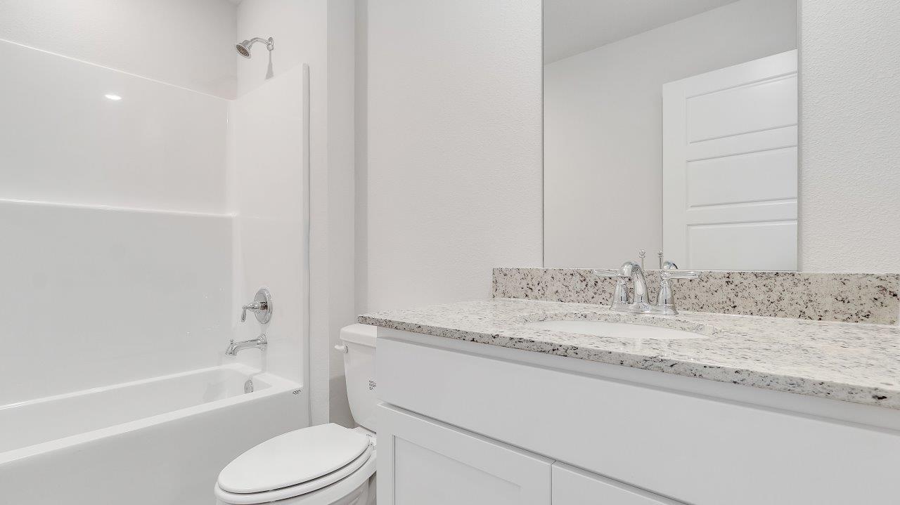 Entering the home, you’ll find access to two bedrooms that share a full bathroom.