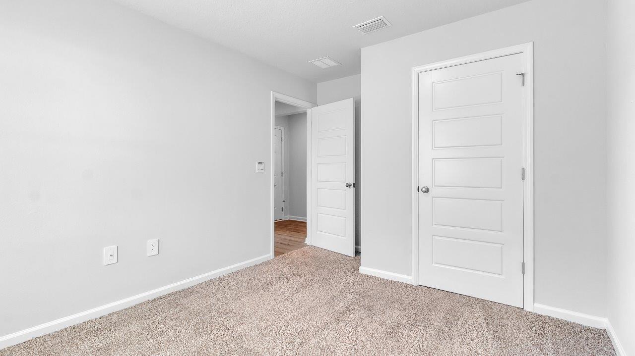 Entering the home, you’ll find access to two bedrooms that share a full bathroom.