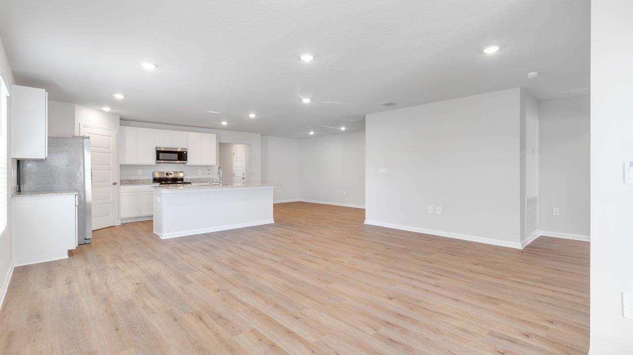 en is ideal for hosting gatherings and enjoying quality time with loved ones. The living area has back door access to a covered porch, further enhancing the relaxing ambiance.