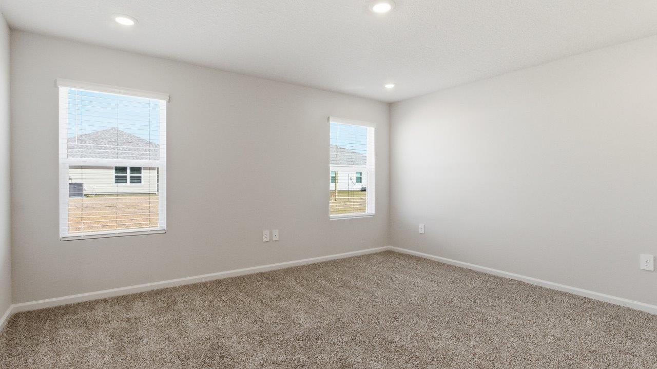 To the opposite side of the home are two bedrooms, a full bathroom with a linen closet and the laundry room. Y