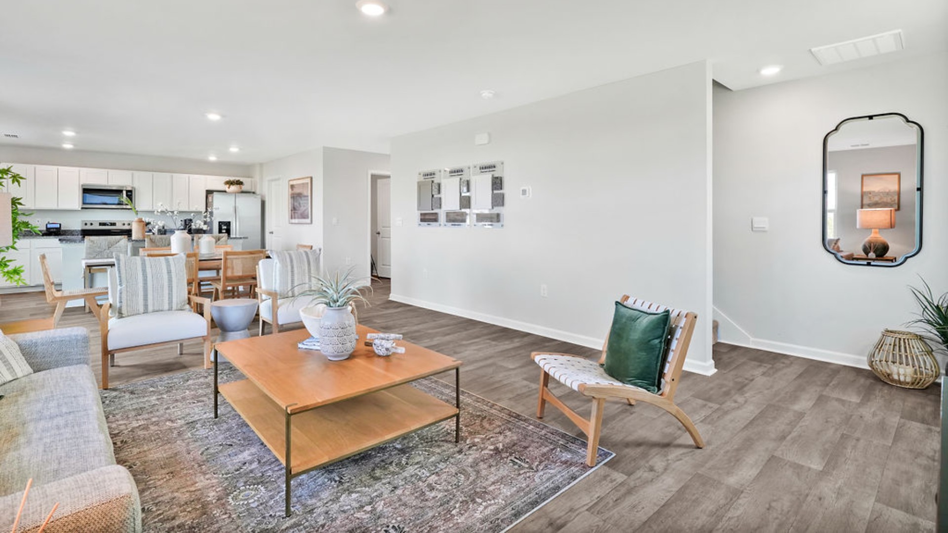 Designed for modern living, the main level features a flexible front room that can serve as a formal dining area, home office, or sitting room. The open-concept kitchen, dining and family room flow seamlessly together, perfect for entertaining and everyday living