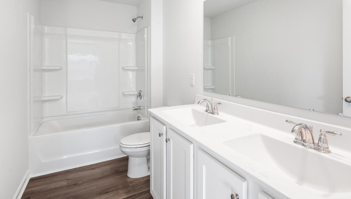 The second floor is complete with 3 additional bedrooms, a shared bathroom, storage & laundry room. Enjoy the patio perfect for entertaining and enjoying the Carolina nights.