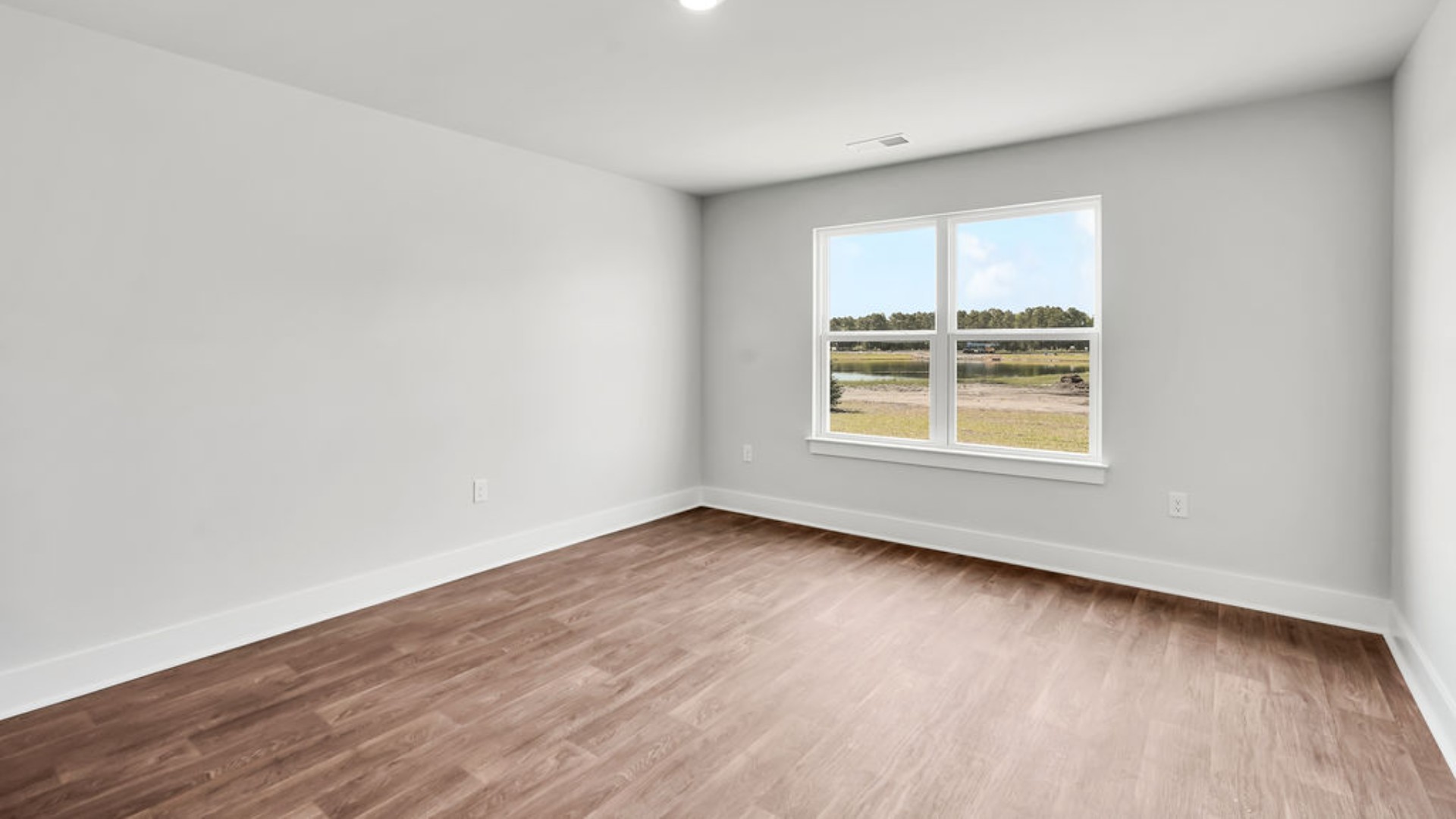 Featuring a first-floor primary bedroom with generous bath and walk-in closet.