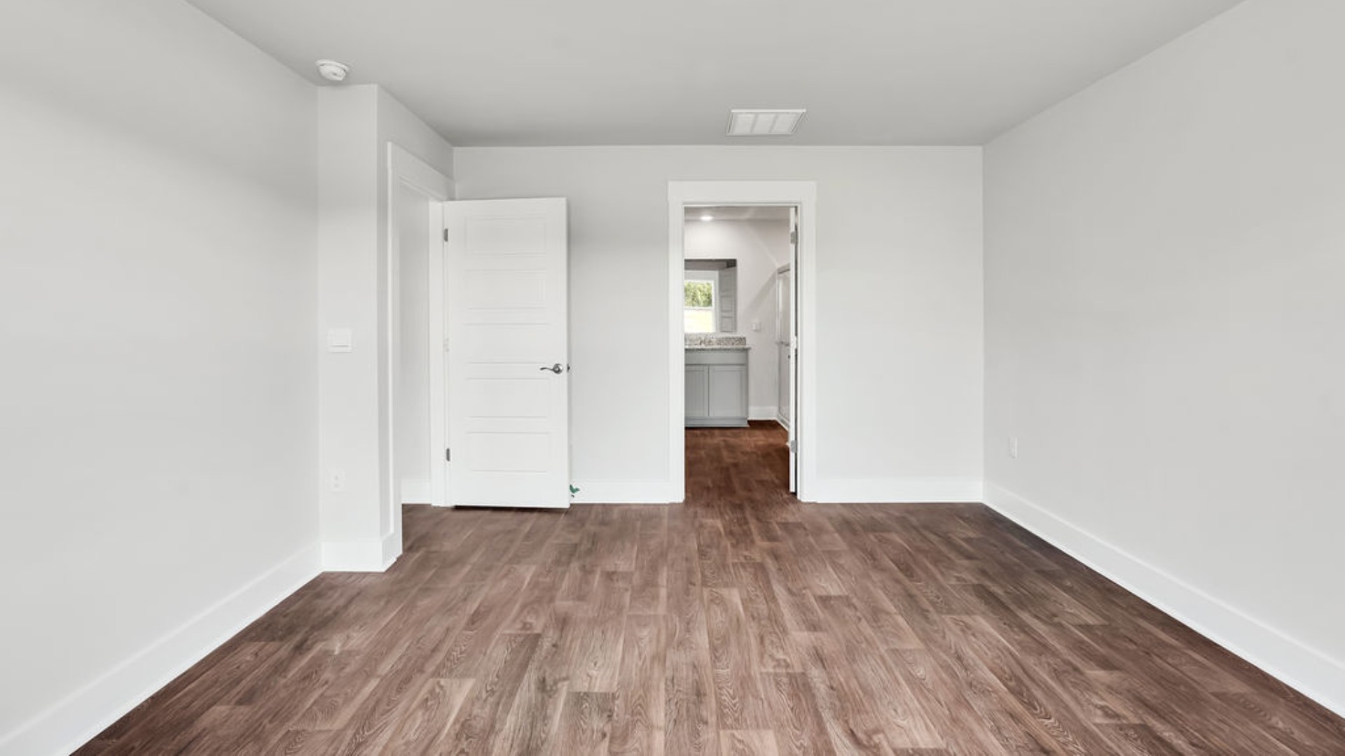 Featuring a first-floor primary bedroom with generous bath and walk-in closet.