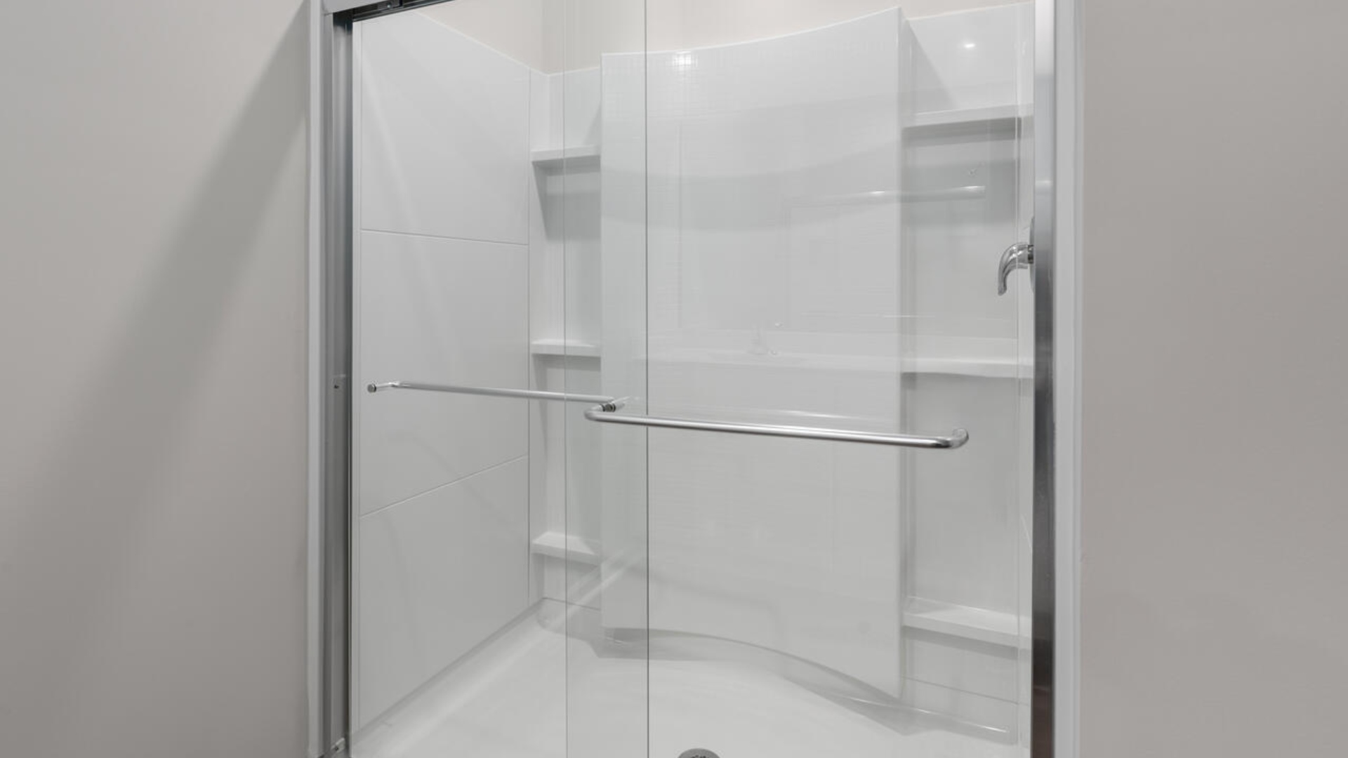 The primary suite offers a spacious walk-in closet and a private bath with dual vanity, walk-in shower, and linen storage.