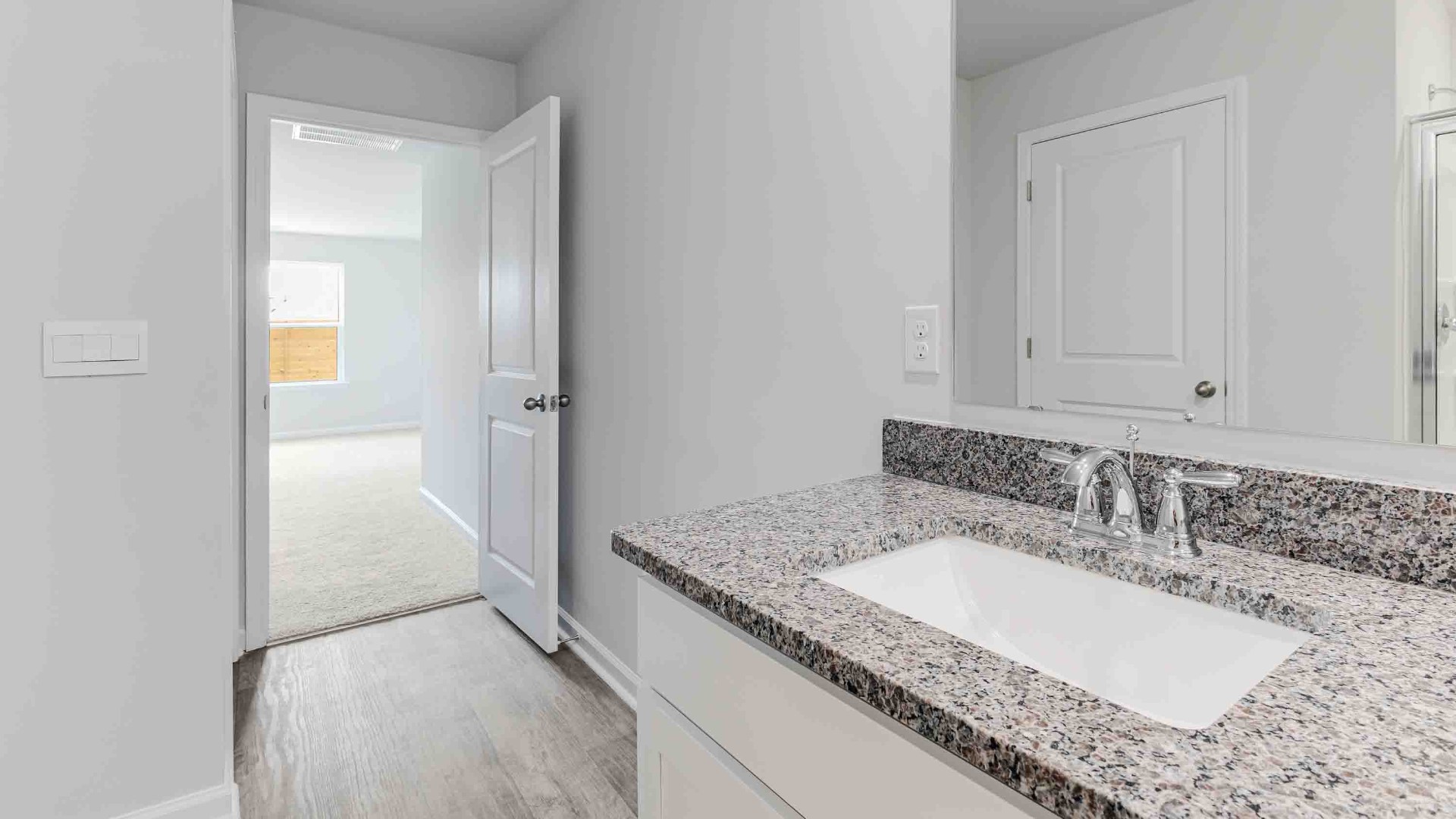 there are another 2 bedrooms and full bath. In every bedroom you’ll have vinyl flooring and a closet in each room. Whether these rooms become bedrooms, office spaces, or other bonus rooms, there is sure to be comfort.