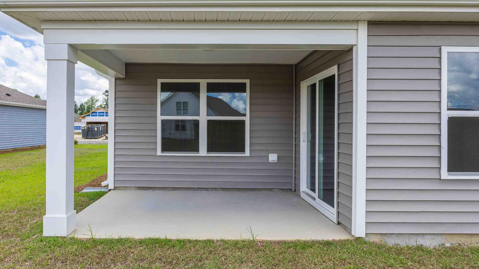 Enjoy the covered porch perfect for entertaining and enjoying the Carolina evenings