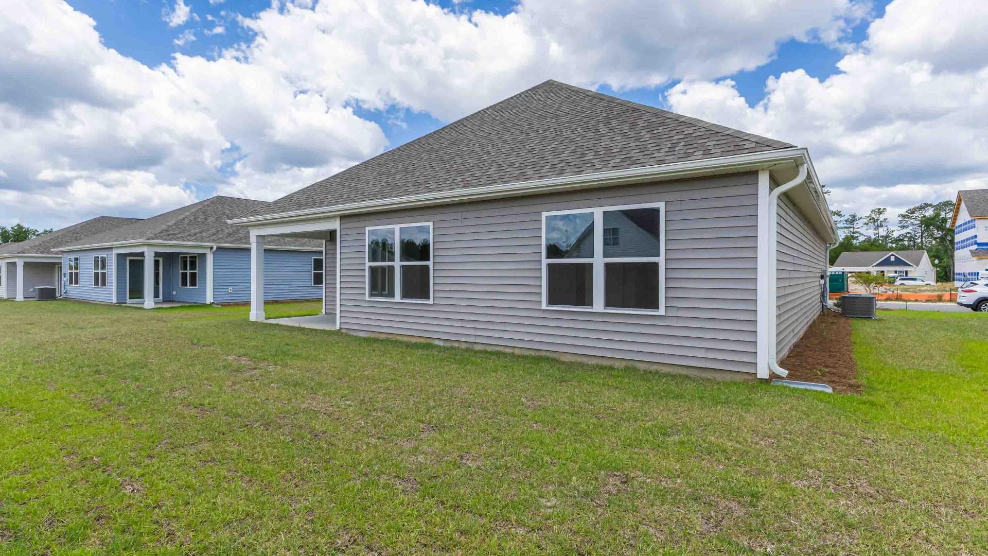 Enjoy the covered porch perfect for entertaining and enjoying the Carolina evenings