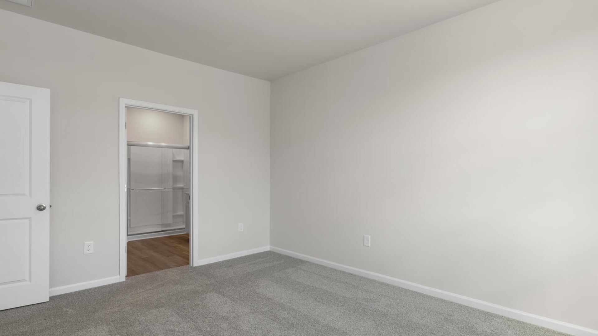 The spacious primary suite includes a walk-in closet, dual vanity, a walk-in shower, and a private toilet area for added convenience.