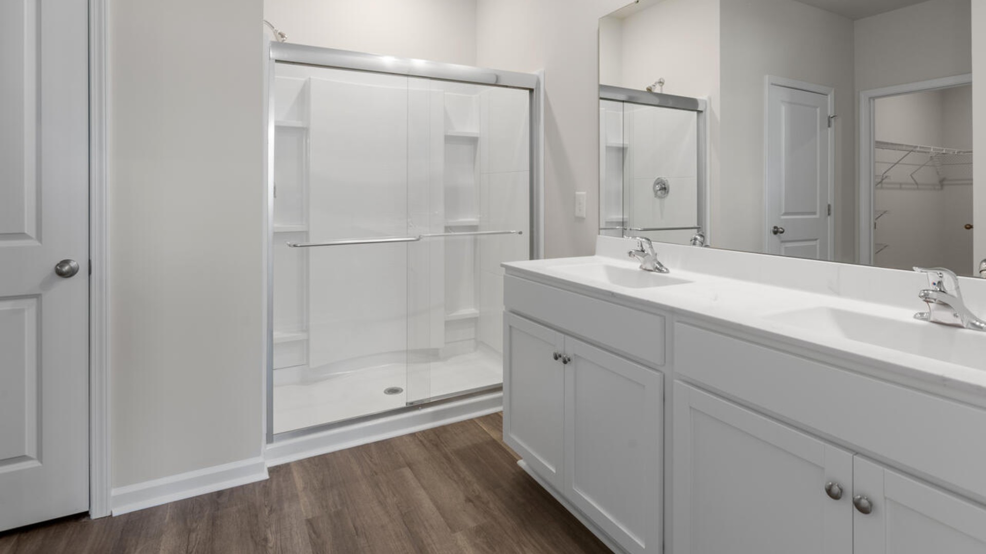 The spacious primary suite includes a walk-in closet, dual vanity, a walk-in shower, and a private toilet area for added convenience.