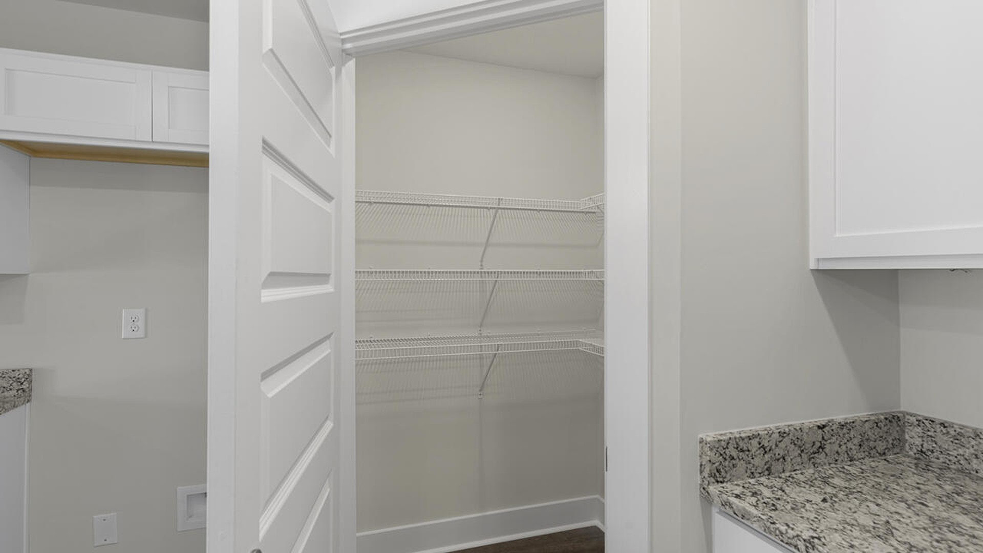 The kitchen features beautiful cabinets, granite countertops, and stainless steel appliances, which are sure to both turn heads and make meal prep easy.