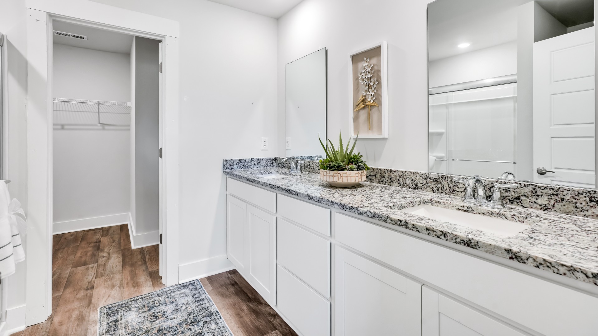 The primary bedroom has its own attached bathroom that features a walk-in closet and all the space you need to get ready in the morning.