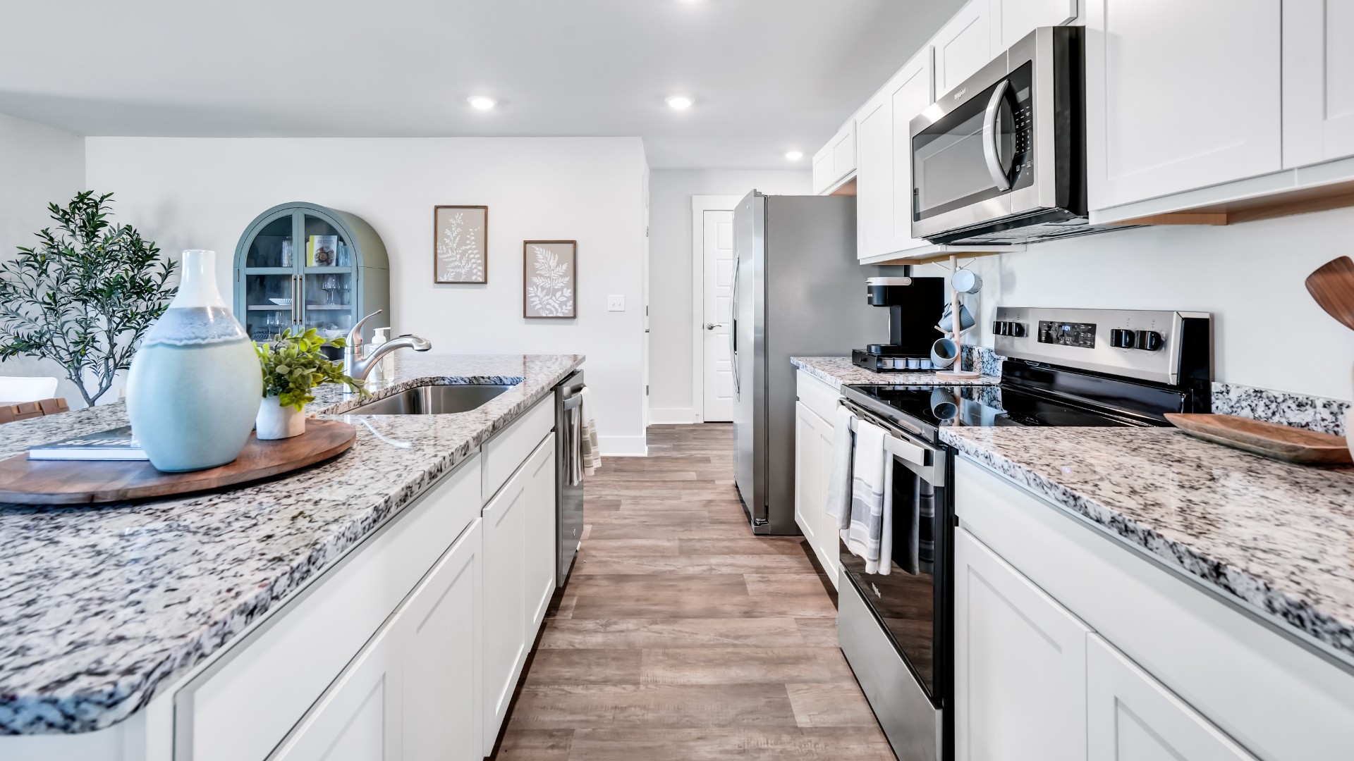 The kitchen features beautiful cabinets, granite countertops, and stainless-steel appliances, which are sure to both turn heads and make meal prep easy. You’ll never be too far from the action with the living and dining area right there.