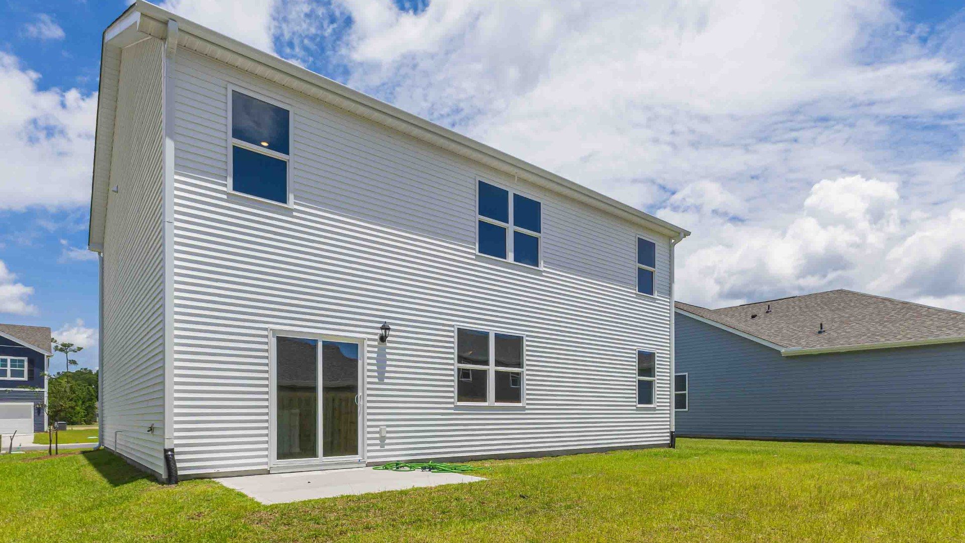 Enjoy the patio perfect for entertaining and enjoying the Carolina evenings. If you're seeking a spacious home with modern features, the Hayden Floorplan is a top choice.