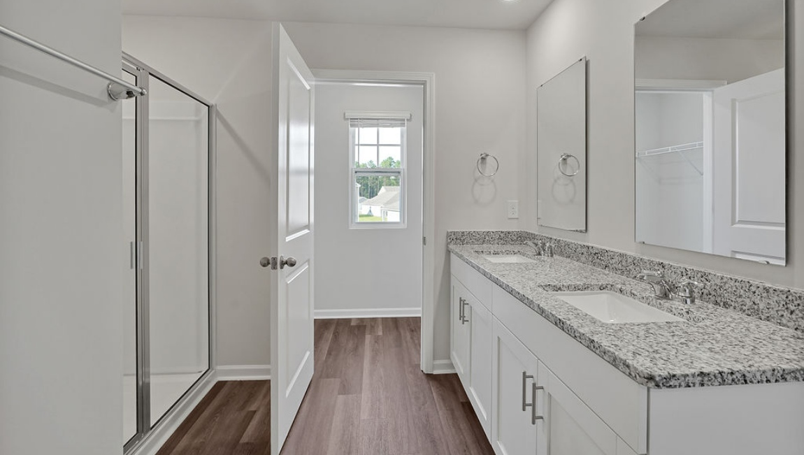 New Homes in Jacksonville NC. Vineyard Trail. The Hayden Floorplan offers 2,511 square feet with 5 bedrooms, 3 full bathrooms, and a 2-car garage. The upstairs has an additional living space, a laundry room, and a Primary Bedroom. Downstairs, a flex room can be used as an office or sitting area, while the open-concept kitchen features granite countertops and stainless steel appliances. The kitchen seamlessly connects to the dining and living areas, creating a great space for entertainment. If you're seeking a spacious home with modern features, the Hayden Floorplan is a top choice.