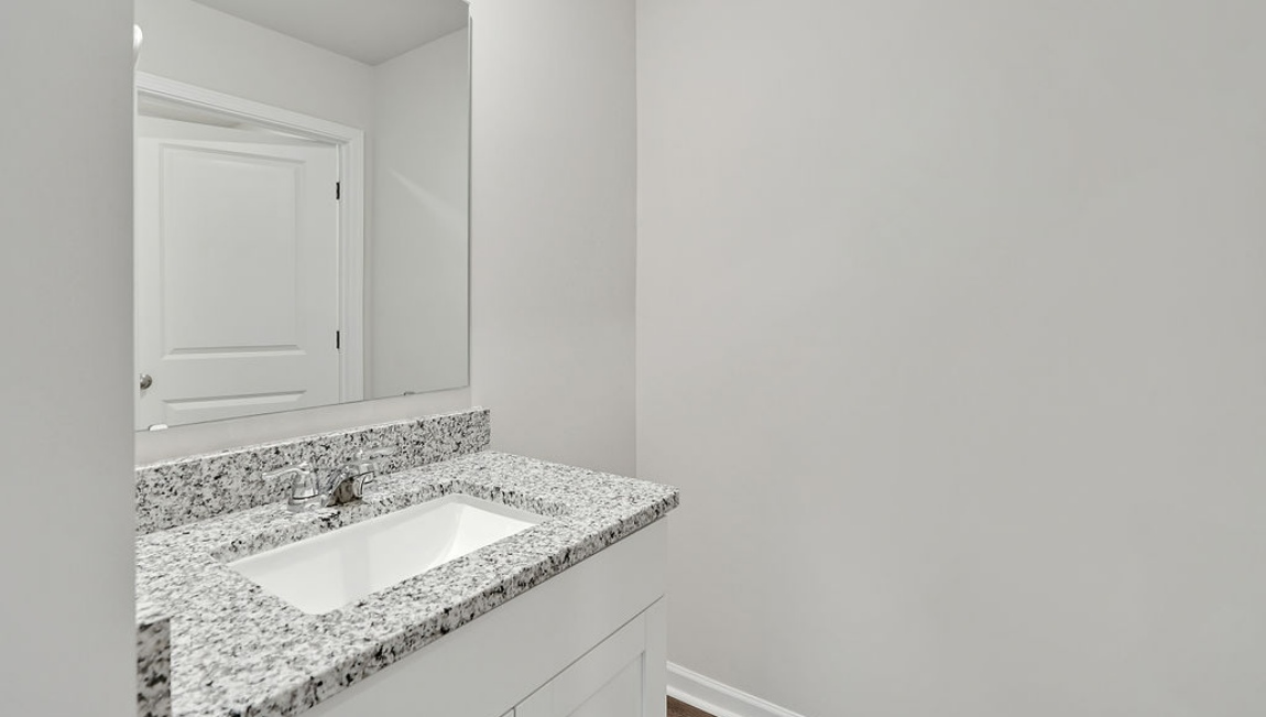 New Homes in Jacksonville NC. Vineyard Trail. The Hayden Floorplan offers 2,511 square feet with 5 bedrooms, 3 full bathrooms, and a 2-car garage. The upstairs has an additional living space, a laundry room, and a Primary Bedroom. Downstairs, a flex room can be used as an office or sitting area, while the open-concept kitchen features granite countertops and stainless steel appliances. The kitchen seamlessly connects to the dining and living areas, creating a great space for entertainment. If you're seeking a spacious home with modern features, the Hayden Floorplan is a top choice.