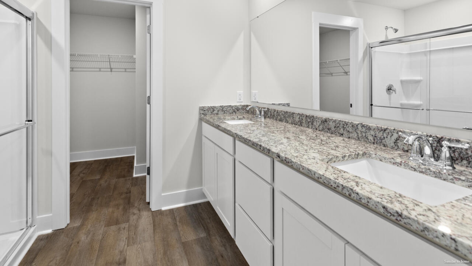 The primary bedroom has its own attached bathroom that features a walk-in closet and all the space you need to get ready in the morning.