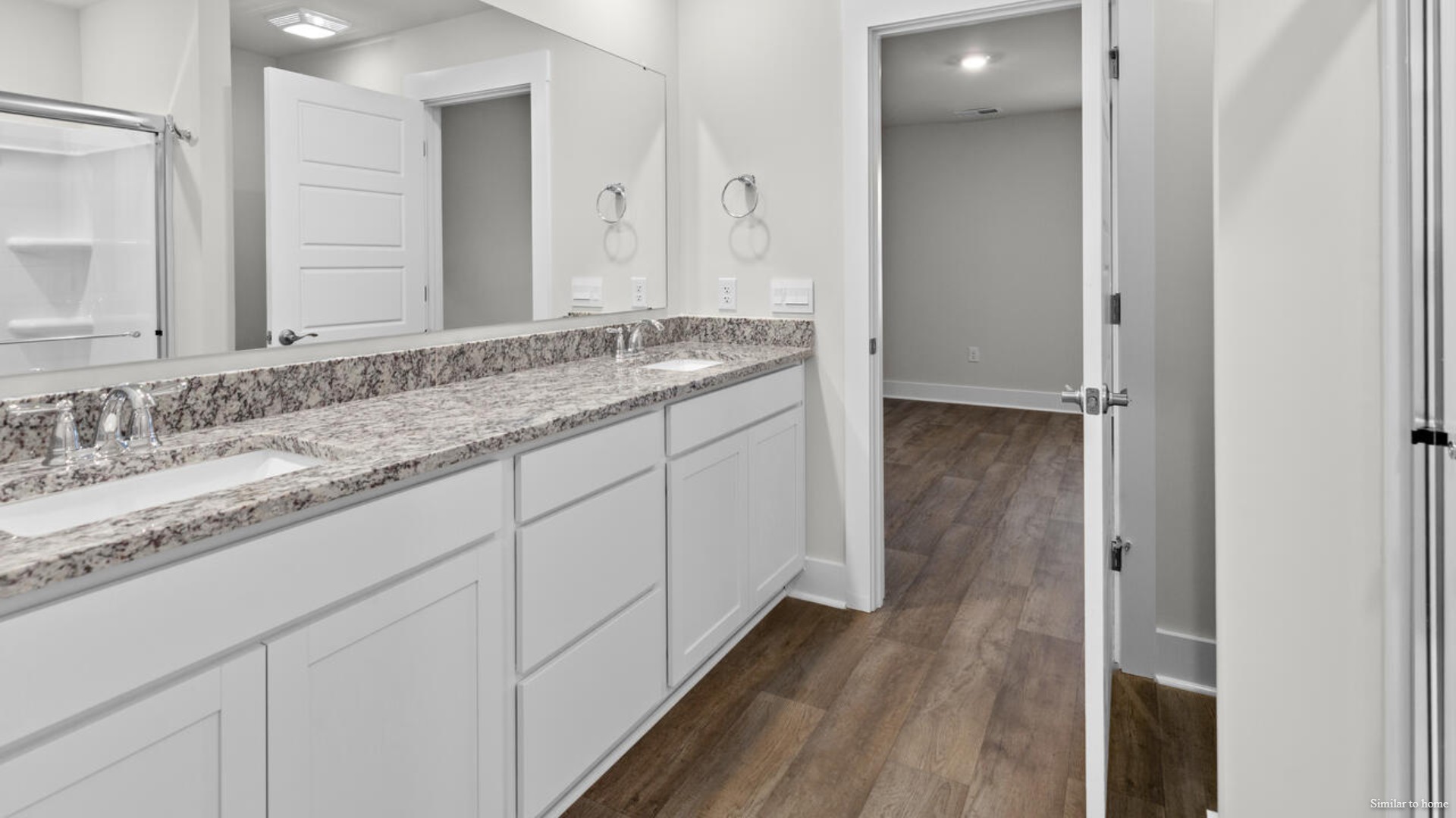 The primary bedroom has its own attached bathroom that features a walk-in closet and all the space you need to get ready in the morning.