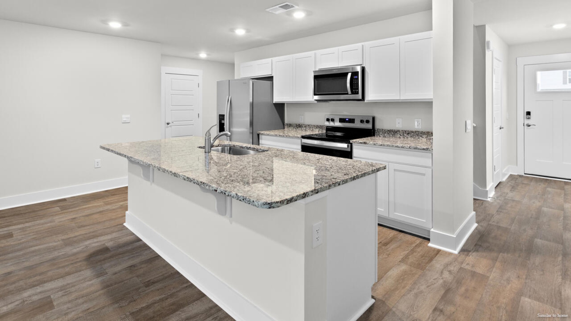 The kitchen features beautiful cabinets, granite countertops, and stainless-steel appliances, which are sure to both turn heads and make meal prep easy.