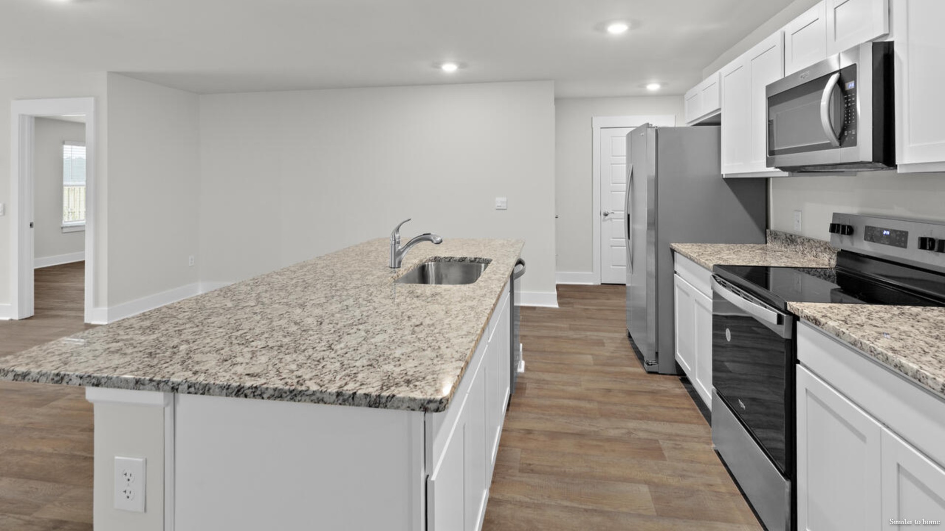 The kitchen features beautiful cabinets, granite countertops, and stainless-steel appliances, which are sure to both turn heads and make meal prep easy.