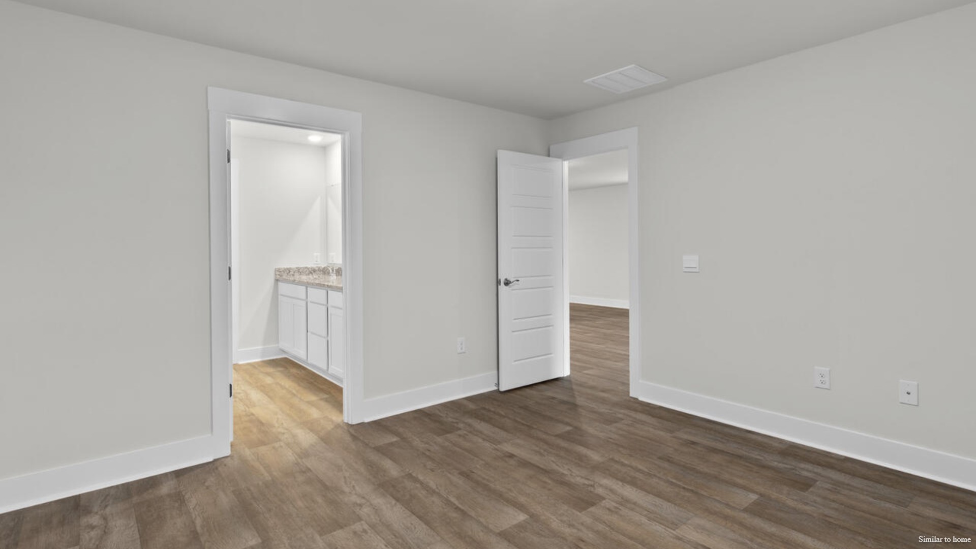 The primary bedroom has its own attached bathroom that features a walk-in closet and all the space you need to get ready in the morning.
