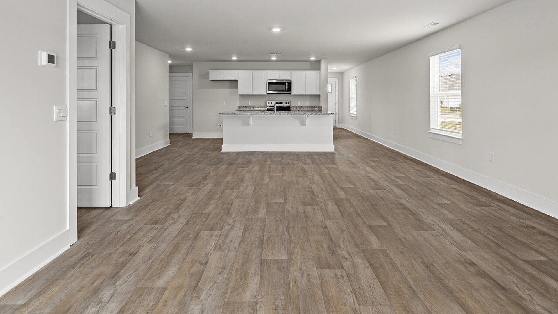 The living area is an open concept, where your kitchen, living, and dining areas blend seamlessly into a space perfect for everyday living and entertaining.