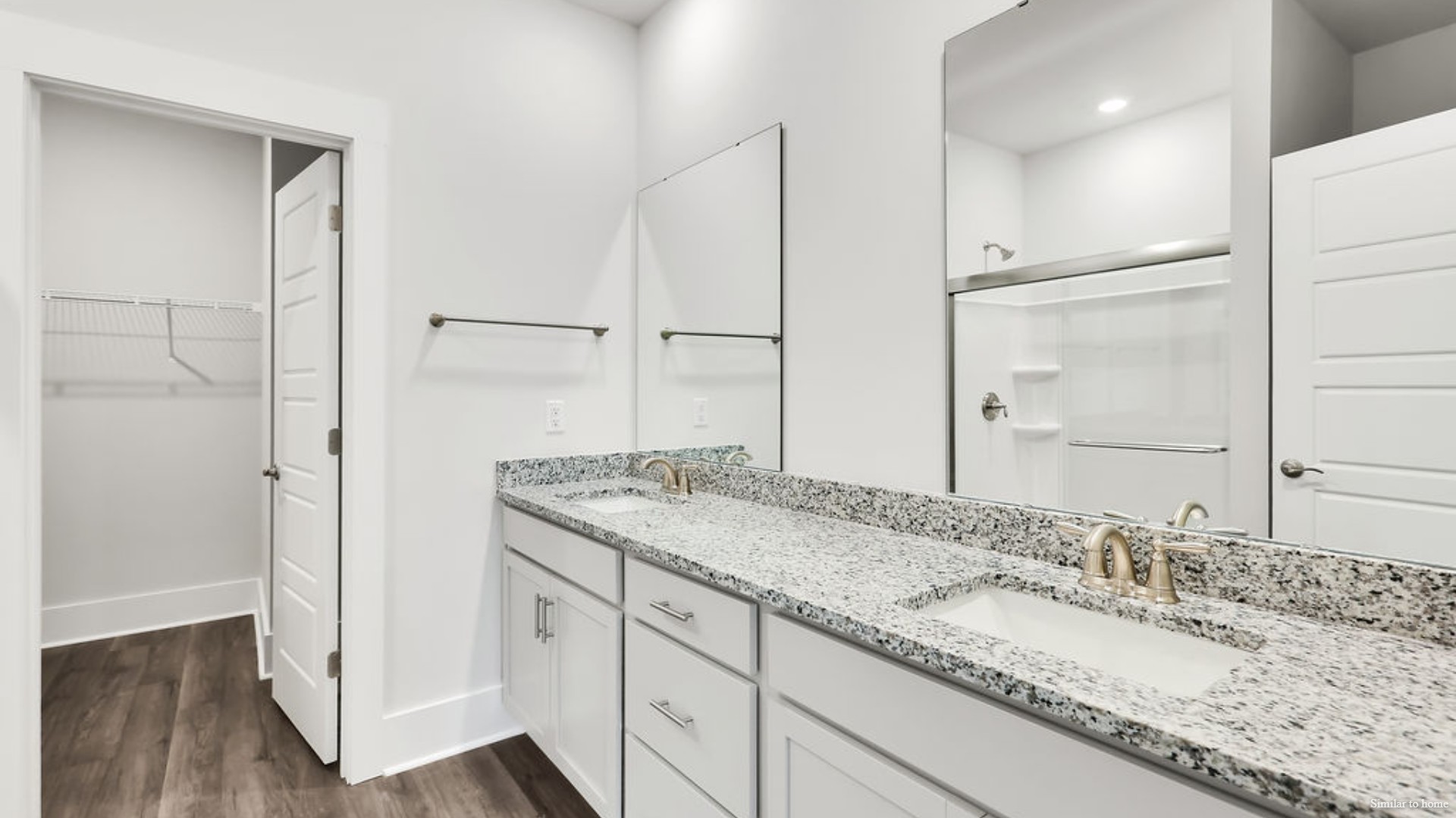 The primary bedroom has its own attached bathroom that features a walk-in closet and all the space you need to get ready in the morning.