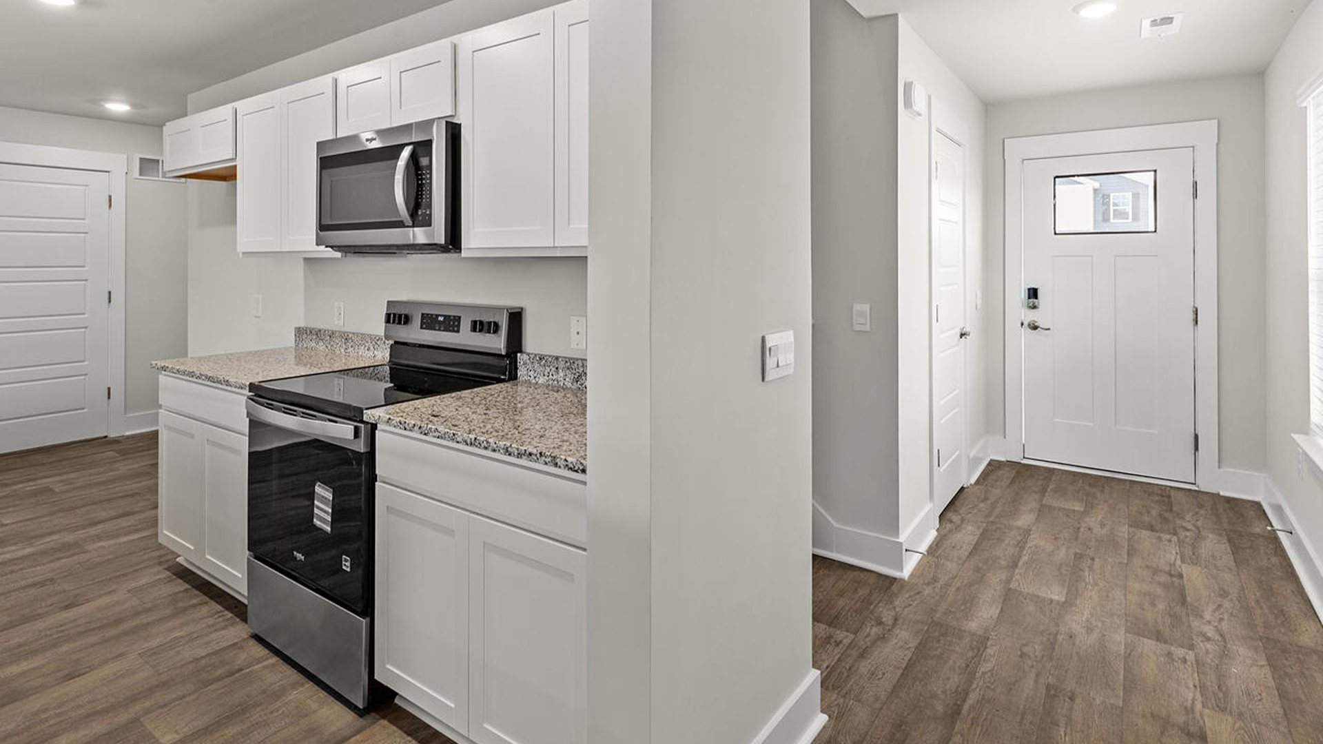 The kitchen features beautiful cabinets, granite countertops, and stainless-steel appliances, which are sure to both turn heads and make meal prep easy. You’ll never be too far from the action with the living and dining area right there.