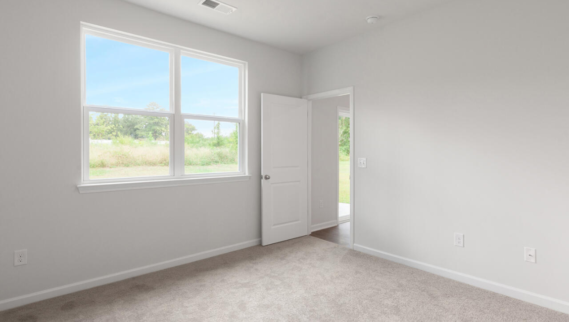 he primary suite is located at the back of the home and includes a walk-in closet and an en-suite bathroom for added comfort.