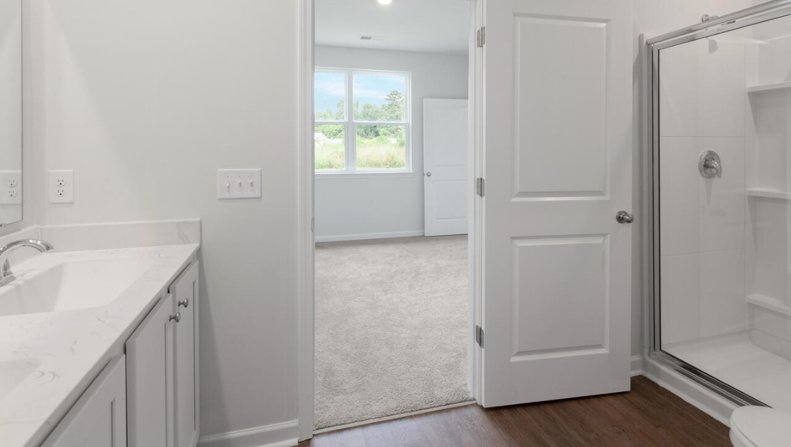he primary suite is located at the back of the home and includes a walk-in closet and an en-suite bathroom for added comfort.