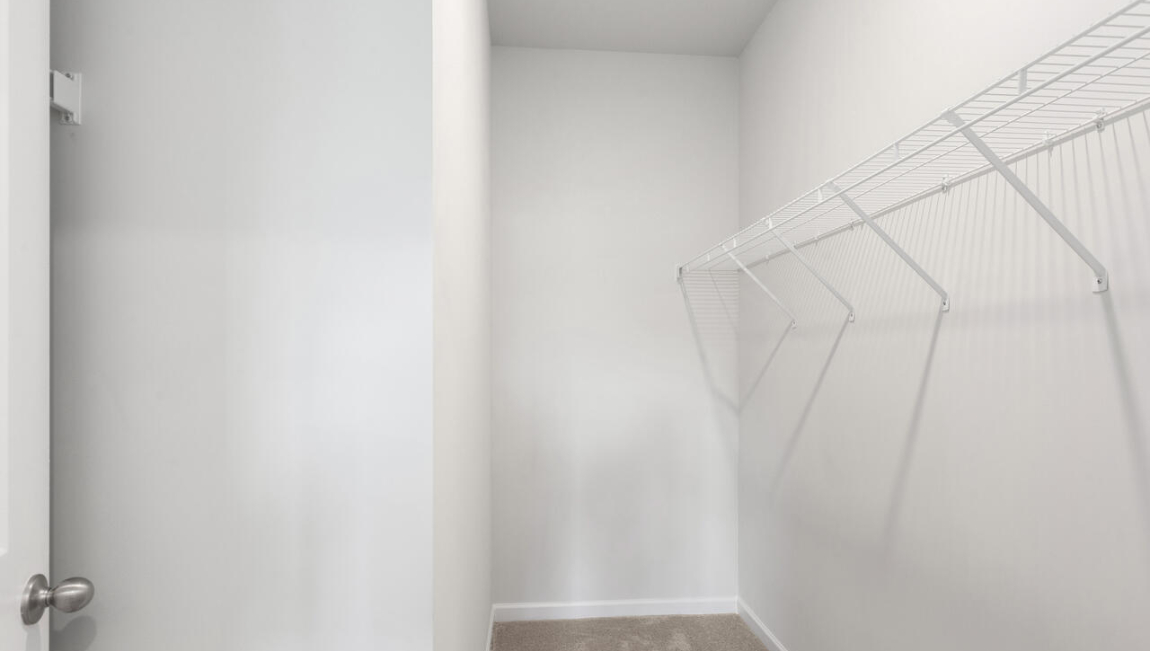 he primary suite is located at the back of the home and includes a walk-in closet and an en-suite bathroom for added comfort.